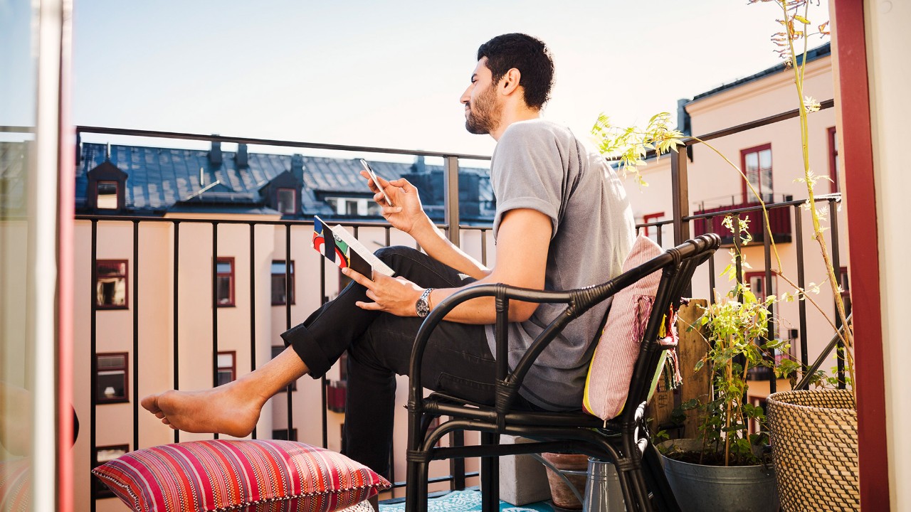 Man sitting on a chair using mobile
